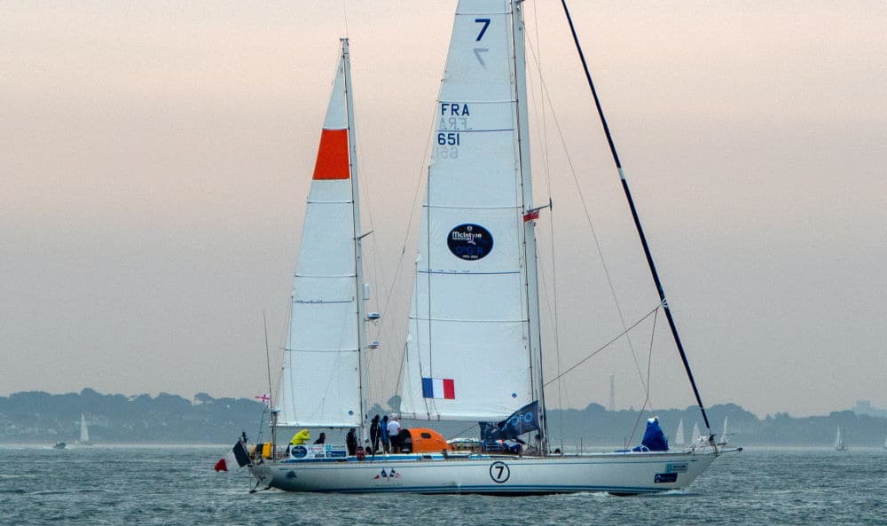 racing sailboat on water